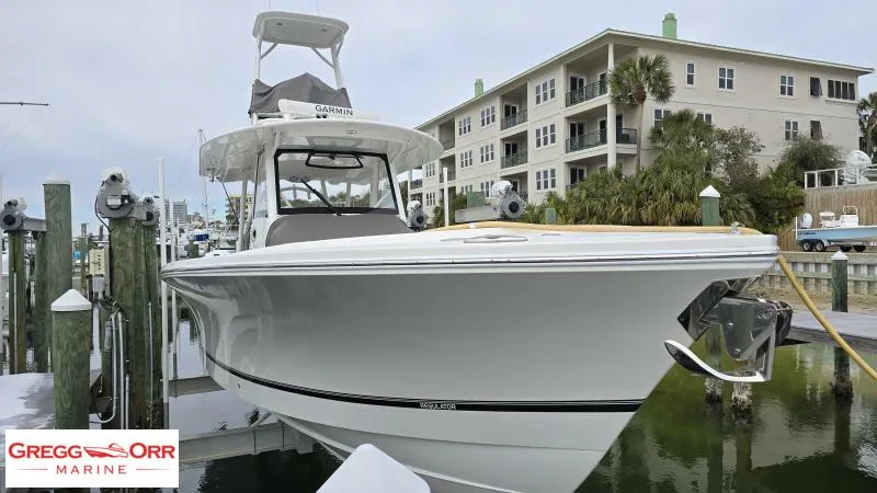 Slide: The Image of 2021 Regulator 41 boat docked at marina, Gregg Orr Marine branding visible. - 12