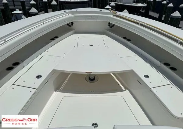 Slide: The Image of 2021 Regulator 41 boat deck with spacious seating and storage compartments. - 14