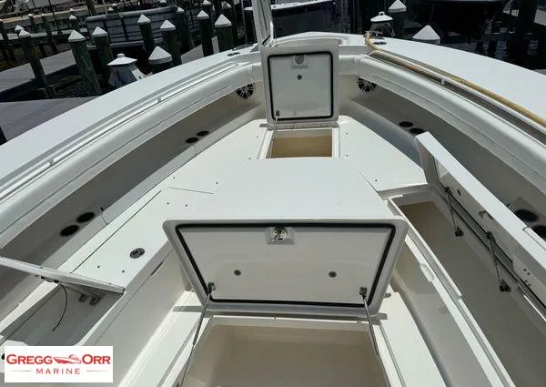 Slide: The Image of 2021 Regulator 41 boat deck with open storage compartments at Gregg Orr Marine. - 15