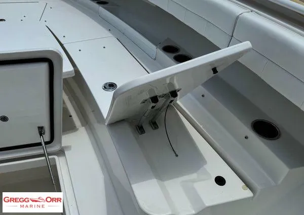 Slide: The Image of 2021 Regulator 41 boat storage compartment open, showcasing interior details. - 19