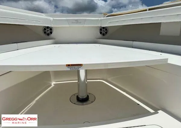 Slide: The Image of 2021 Regulator 41 boat interior with seating and table, Gregg Orr Marine branding. - 21