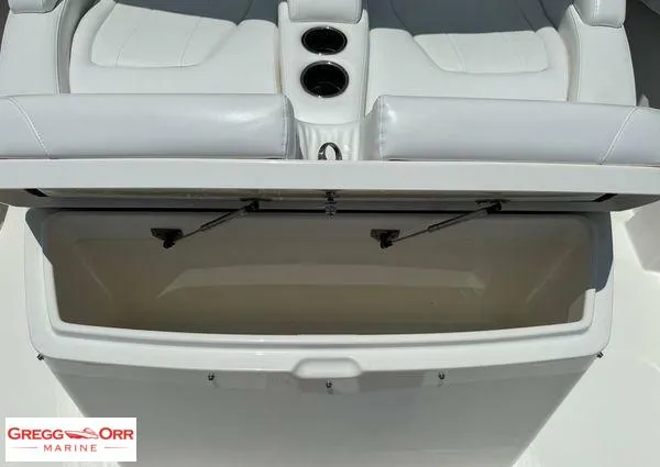 Slide: The Image of 2021 Regulator 41 boat seating with storage compartment and cup holders. - 23
