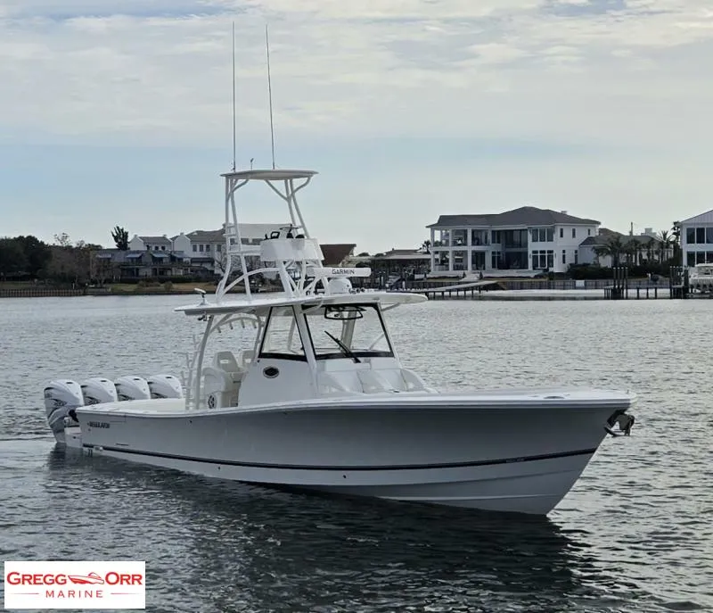 Slide: The Image of 2021 Regulator 41 boat on water near waterfront homes, Gregg Orr Marine logo visible. - 3