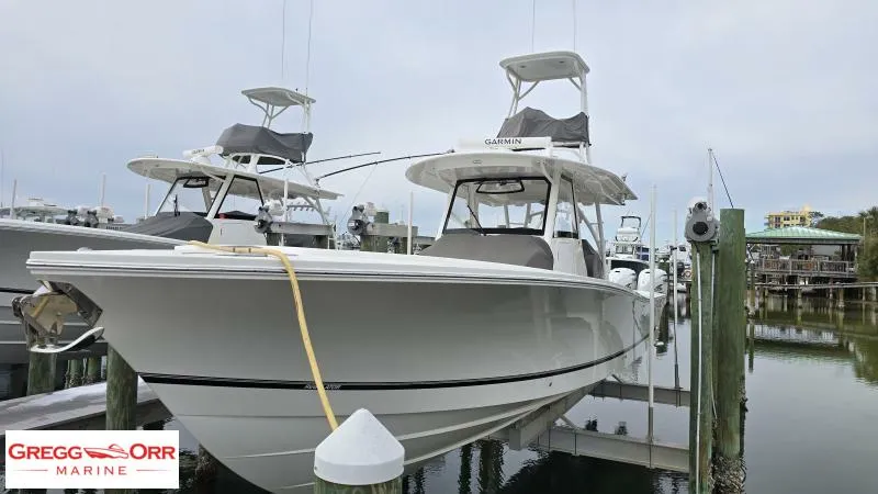 Slide: The Image of 2021 Regulator 41 boat docked at marina, Gregg Orr Marine logo visible. - 7