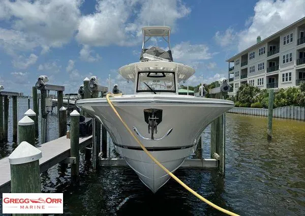 Slide: The Image of 2021 Regulator 41 boat docked at marina, clear sky, Gregg Orr Marine logo visible. - 9