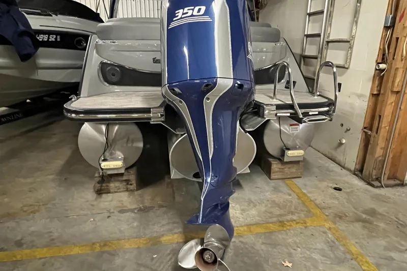 Slide: The Image of 2020 Bennington QX 25 Fastback with 350 horsepower outboard motor in storage. - 21