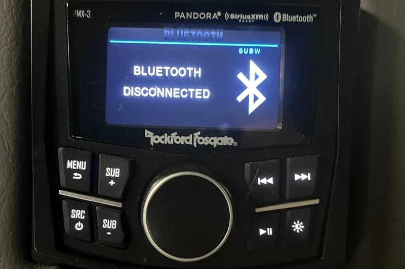 Slide: The Image of Rockford Fosgate audio system showing Bluetooth disconnected on Bennington QX 25 QXFBWA Fastback. - 28