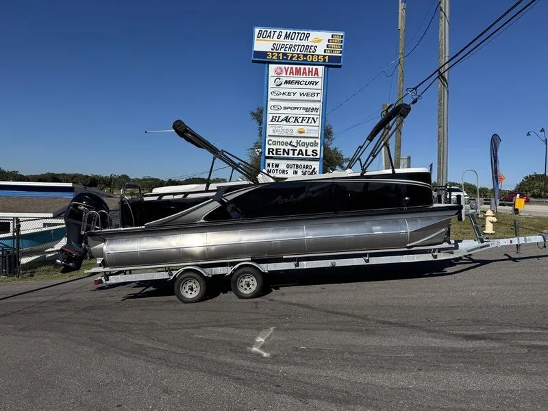 The Image of 2025 Avalon LSZ Quad Lounger on trailer at boat dealership. - 0