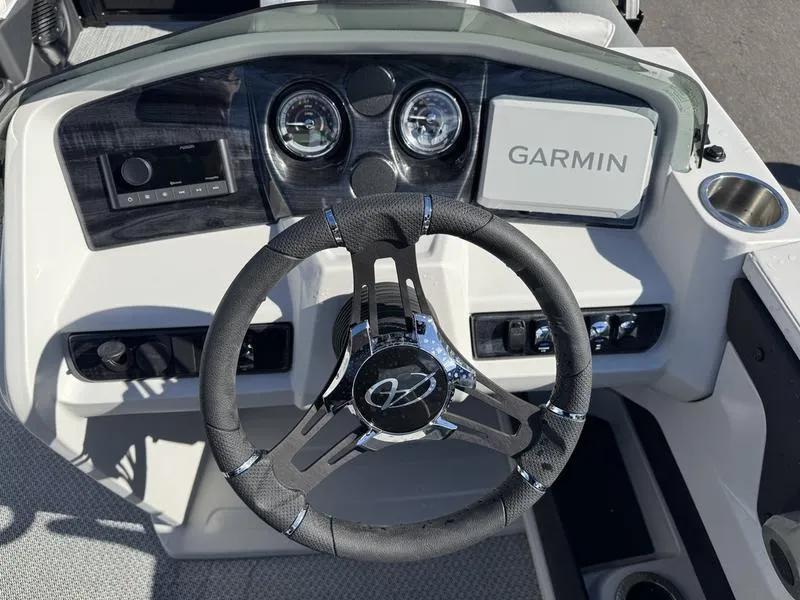 Slide: The Image of 2025 Avalon LSZ Quad Lounger dashboard with Garmin navigation and modern steering wheel. - 6
