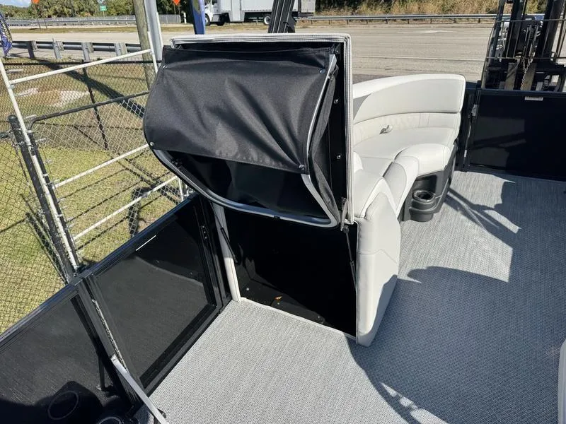 Slide: The Image of 2025 Avalon LSZ Quad Lounger interior with seating and storage compartment. - 7