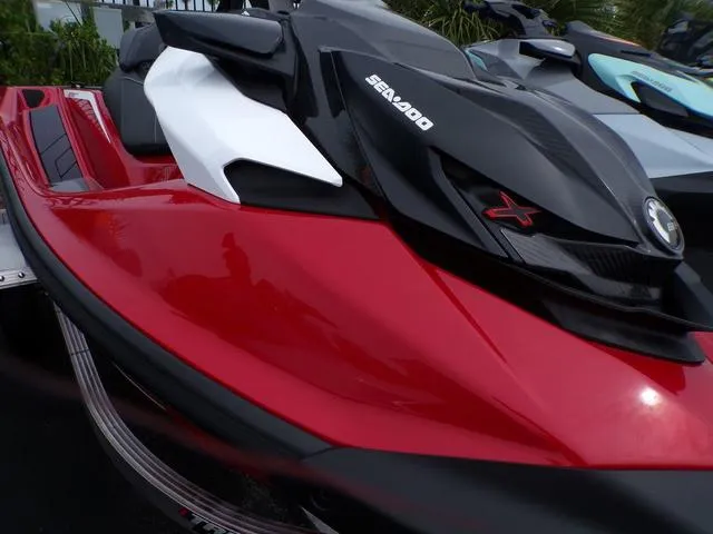 Slide: The Image of 2024 Sea-Doo RXP-X 325 Ibr Fiery Red Premium Waverunner, sleek design, close-up view. - 6