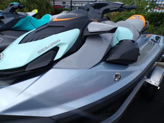 Slide: The Image of 2024 Sea-Doo Waverunner GTI in sleek gray and turquoise design on display. - 12