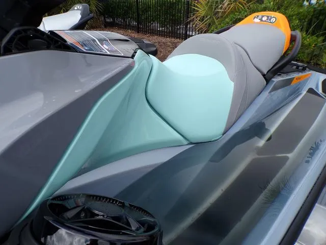 Slide: The Image of 2024 Sea-Doo Waverunner GTI with sleek design and vibrant seat colors. - 13