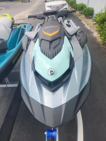 Slide: The Image of 2024 Sea-Doo Waverunner GTI in a parking area, showcasing sleek design and modern features. - 18