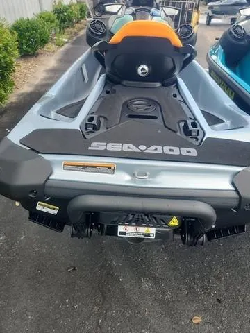 Slide: The Image of 2024 Sea-Doo Waverunner GTI, rear view, parked on pavement. - 19