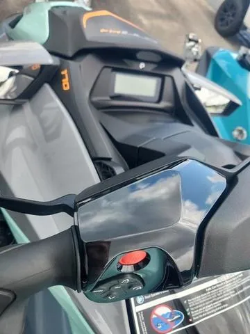 Slide: The Image of 2024 Sea-Doo Waverunner GTI dashboard and controls, featuring sleek design and modern technology. - 21