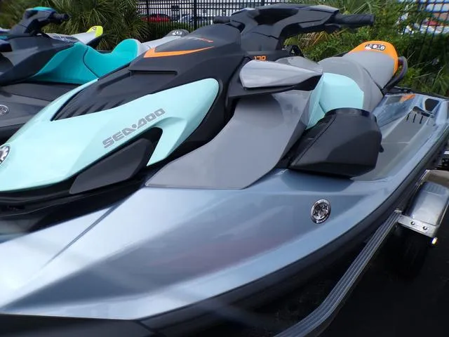 Slide: The Image of 2024 Sea-Doo Waverunner GTI in sleek gray and turquoise design on display. - 12