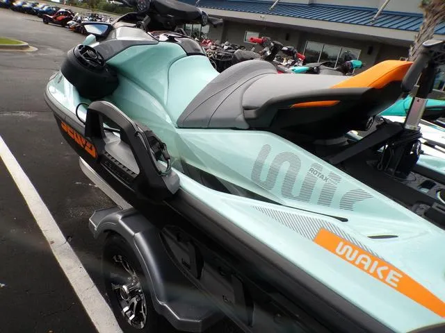 Slide: The Image of 2024 Sea-Doo Waverunner GTI in mint green, parked on a trailer. - 6