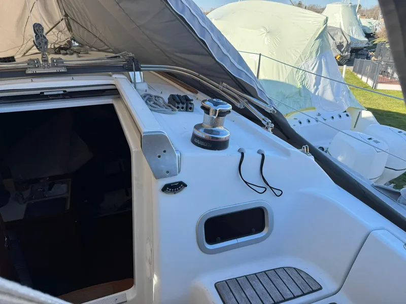 Slide: The Image of Beneteau Oceanis 34 sailboat cockpit, 2013 model, with winch and covered deck. - 11