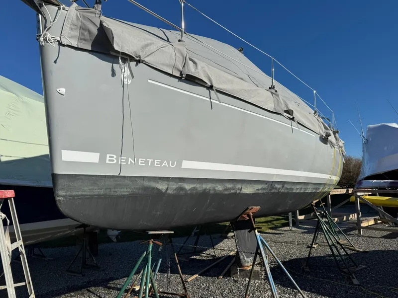 Slide: The Image of 2013 Beneteau Oceanis 34 sailboat on stands, covered, in a boatyard. - 5