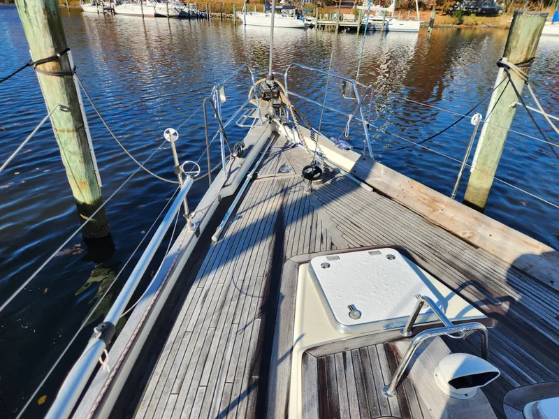 Slide: The Image of Sailboat deck view, Regina 43 model, 2000, docked at marina with calm water. - 15