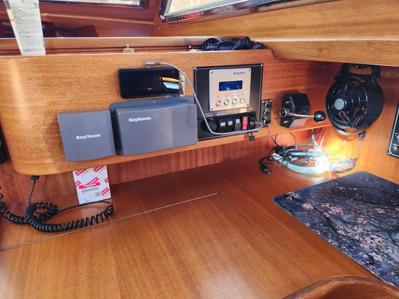 Slide: The Image of Control panel of a 2000 Regina 43 yacht with navigation equipment and radio. - 21