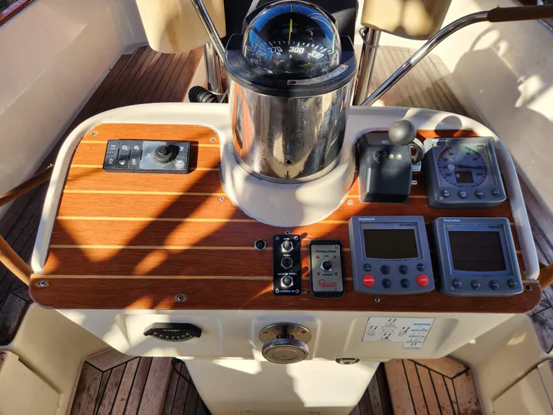 Slide: The Image of Cockpit of a 2000 Regina 43 yacht with navigation instruments and controls. - 24