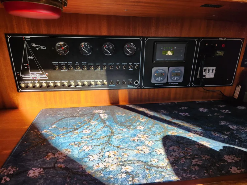 Slide: The Image of Control panel of a 2000 Regina 43 boat with floral-patterned surface. - 31