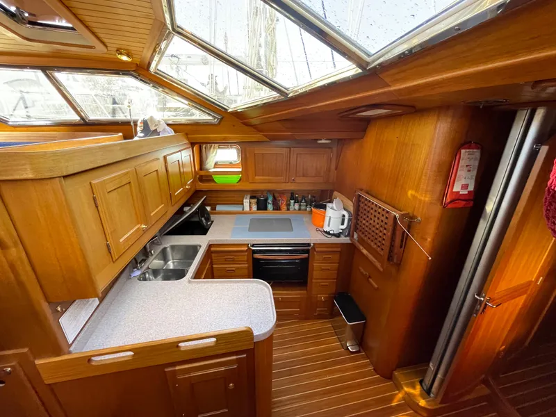Slide: The Image of Wooden yacht kitchen interior with skylights, featuring Regina 43 model, 2000. - 43