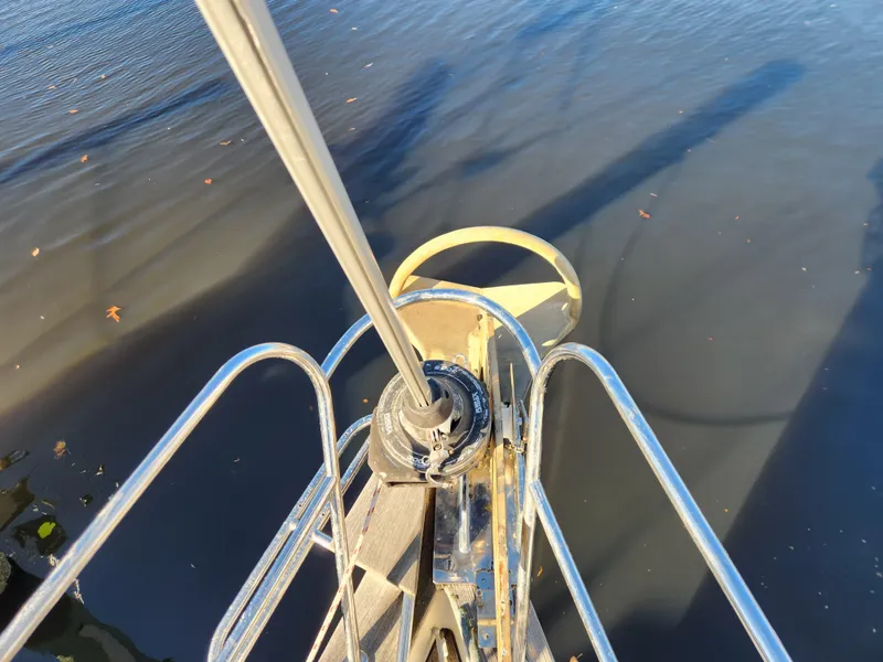 Slide: The Image of Bow of Regina 43 sailboat, 2000 model, with stainless steel railing over calm water. - 7