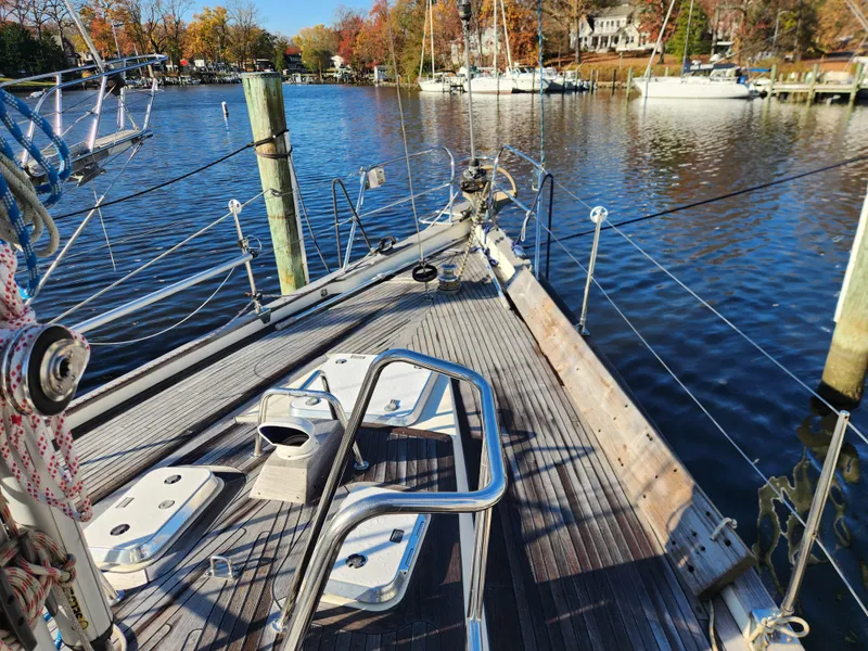 Slide: The Image of Sailboat deck view on a calm marina, Regina 43 model, year 2000. - 9