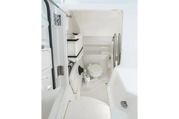 Slide: The Image of 2025 Pursuit S 268 Sport boat interior bathroom with modern amenities. - 7