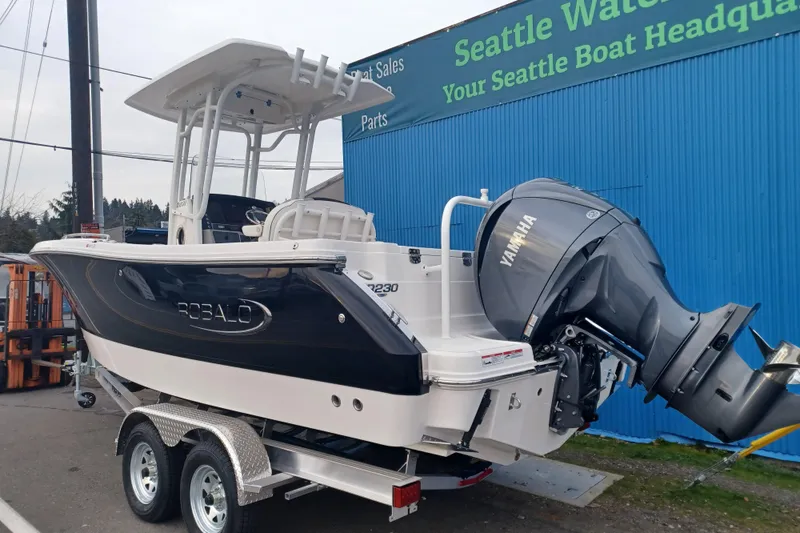 Slide: The Image of 2025 Robalo R230 Center Console boat with Yamaha engine at Seattle dealership. - 1