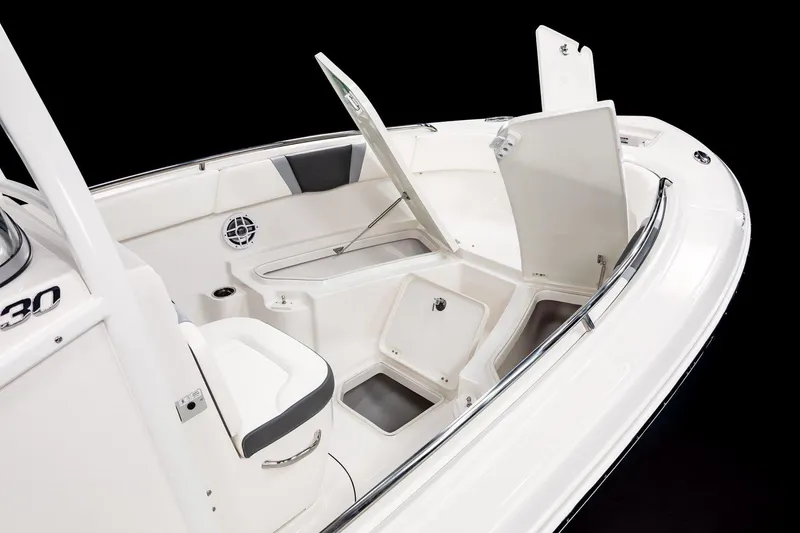 Slide: The Image of 2025 Robalo R230 Center Console boat interior with open storage compartments. - 10