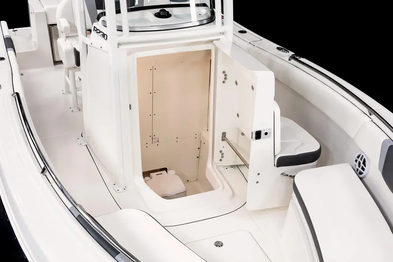 Slide: The Image of 2025 Robalo R230 Center Console boat interior with open storage compartment. - 11