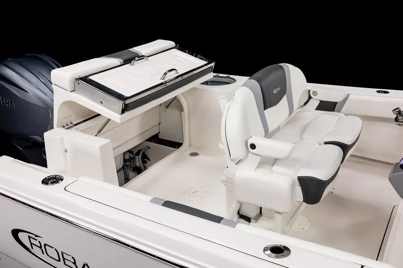 Slide: The Image of 2025 Robalo R230 Center Console boat interior with seating and storage. - 15