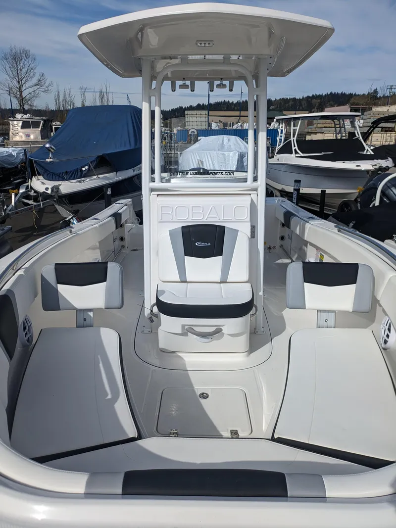 Slide: The Image of 2025 Robalo R230 Center Console boat with spacious seating and sleek design. - 17