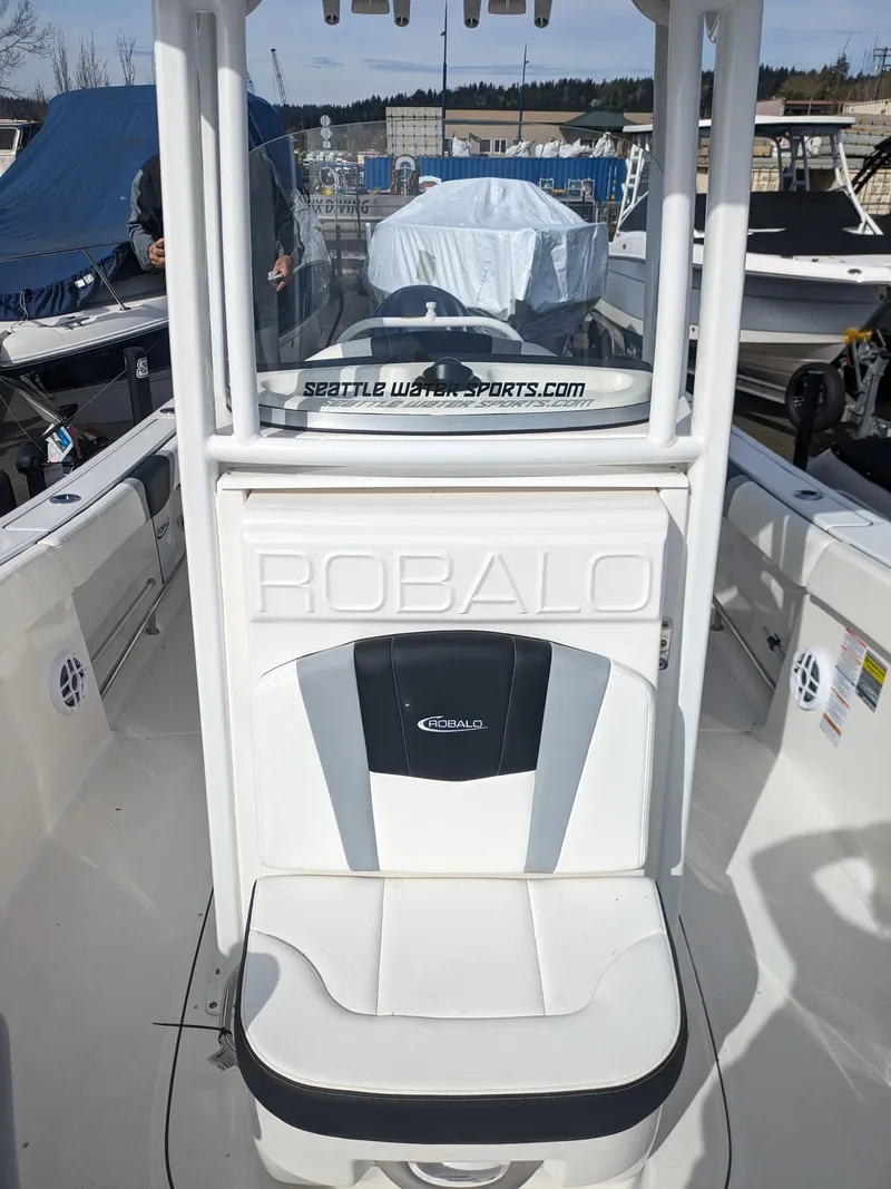 Slide: The Image of 2025 Robalo R230 Center Console boat interior with seating and console details. - 21