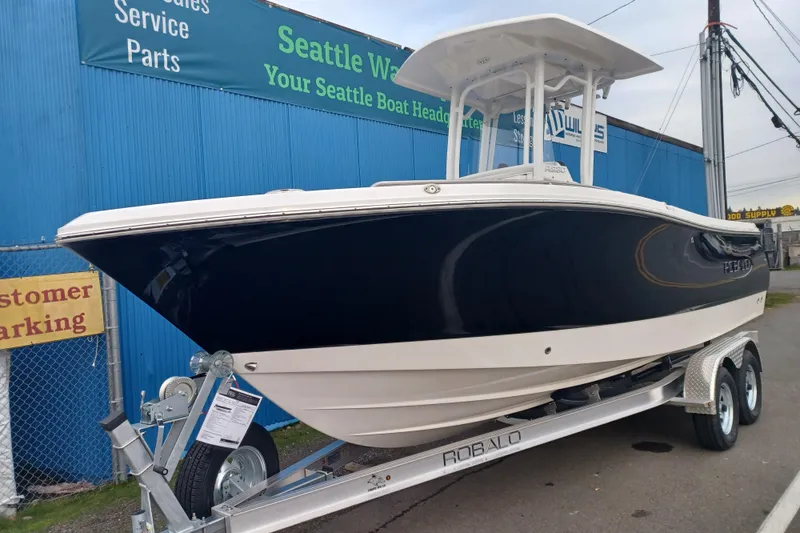 Slide: The Image of 2025 Robalo R230 Center Console boat on trailer at Seattle dealership. - 3