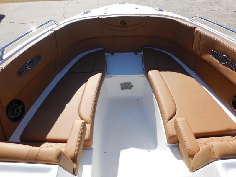 Slide: The Image of 2025 Chaparral 30 Surf boat interior with tan leather seating. - 11