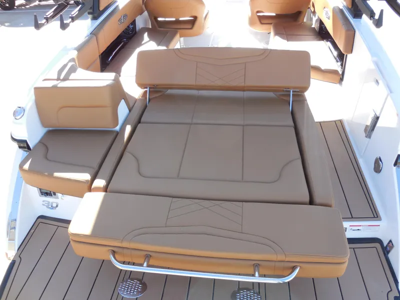 Slide: The Image of 2025 Chaparral 30 Surf boat interior with tan leather seating and spacious layout. - 8