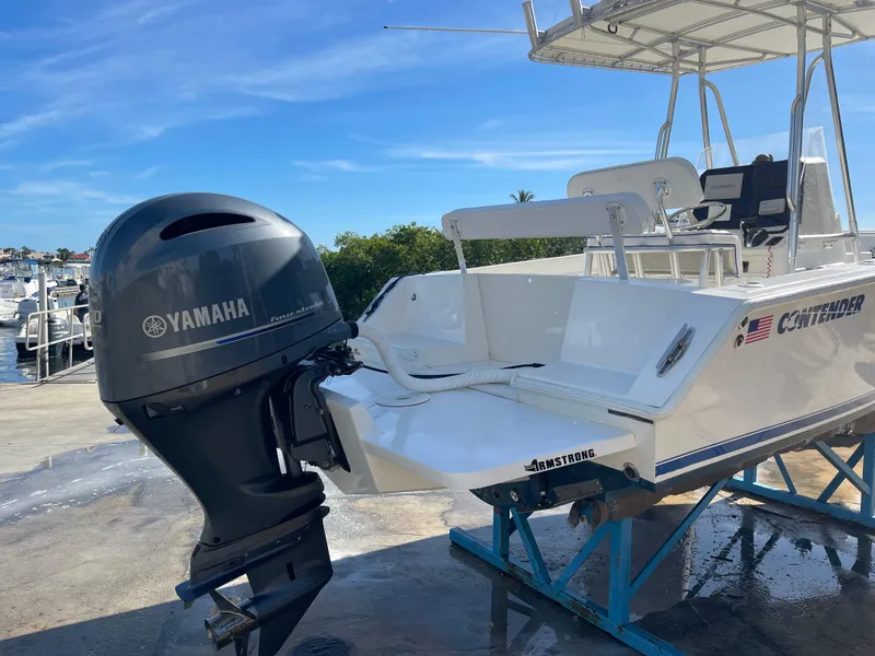 Slide: The Image of 2004 Contender 21 Open boat with Yamaha outboard motor on a stand. - 3