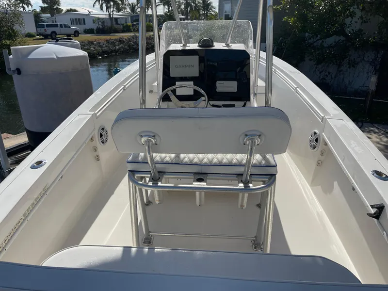 Slide: The Image of 2004 Contender 21 Open boat interior with steering console and seating. - 7
