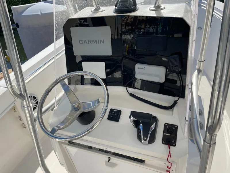 Slide: The Image of Center console of a 2004 Contender 21 Open boat with Garmin navigation system. - 8
