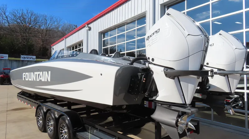 Slide: The Image of 2023 Fountain 34 Thundercat boat with dual engines on a trailer. - 2