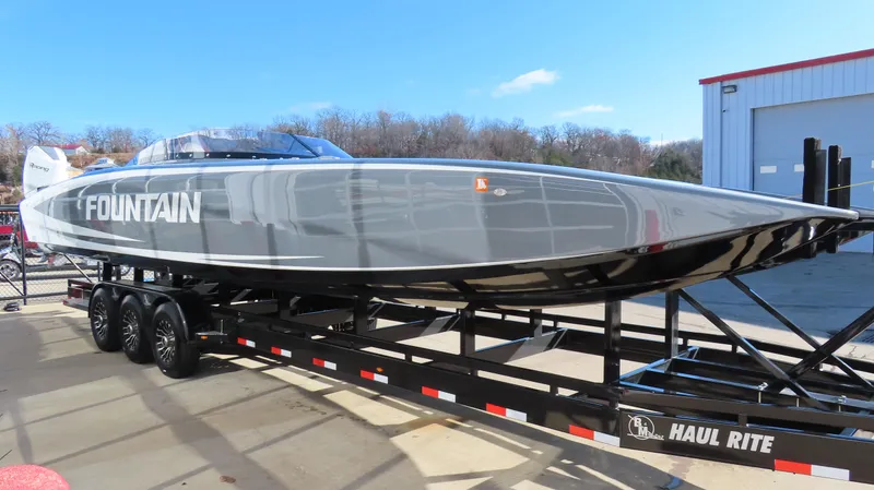 Slide: The Image of 2023 Fountain 34 Thundercat powerboat on trailer, sleek design, outdoor setting. - 3