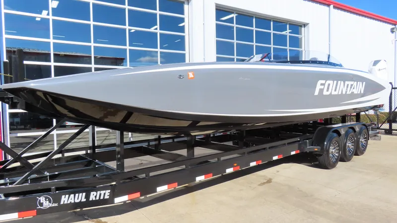 Slide: The Image of 2023 Fountain 34 Thundercat boat on trailer outside showroom. - 4