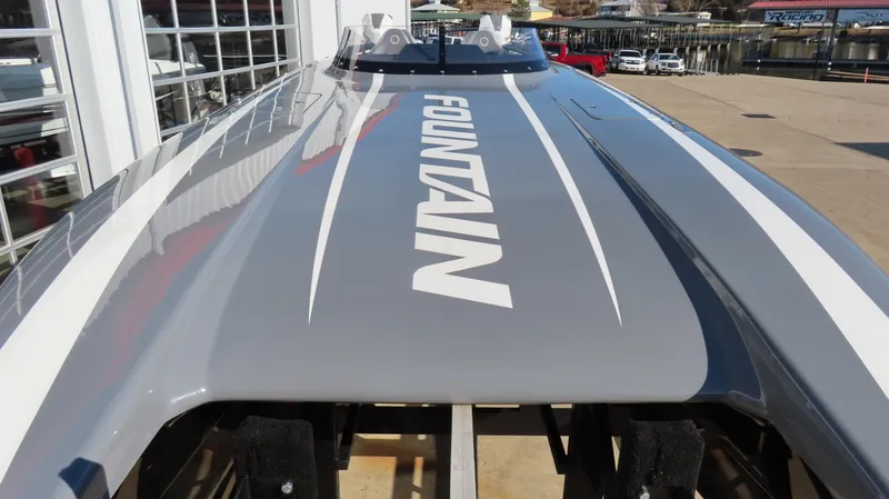 Slide: The Image of 2023 Fountain 34 Thundercat boat, sleek gray design with bold branding. - 5