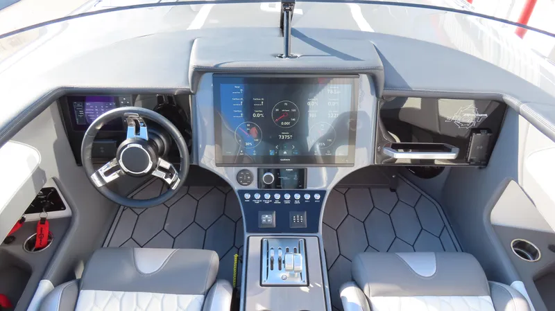 Slide: The Image of 2023 Fountain 34 Thundercat boat dashboard with modern controls and digital display. - 7