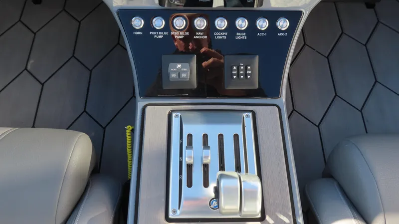 Slide: The Image of 2023 Fountain 34 Thundercat boat controls with sleek dashboard and modern switches. - 9